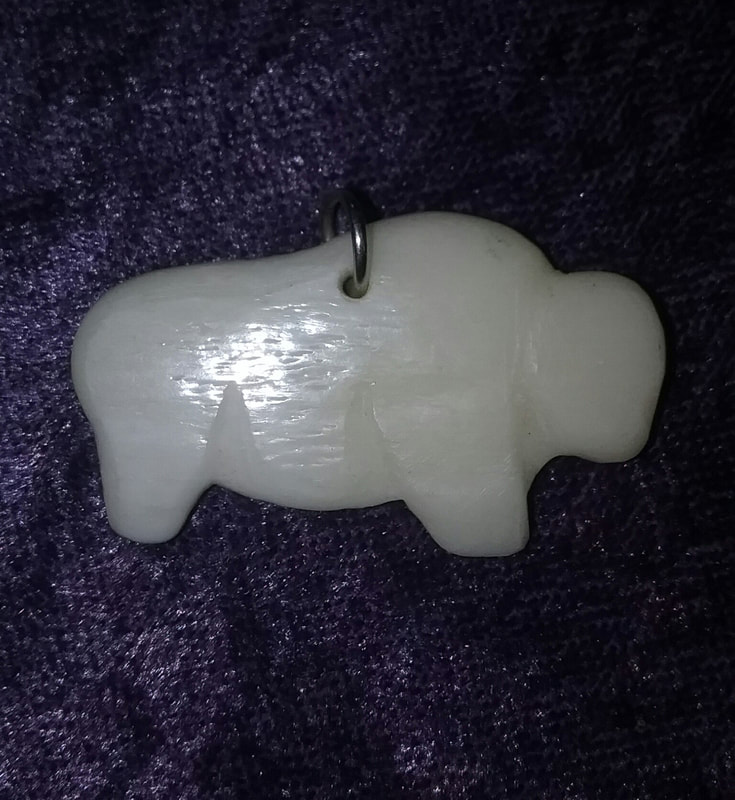 Bison pendant hand carved from bone